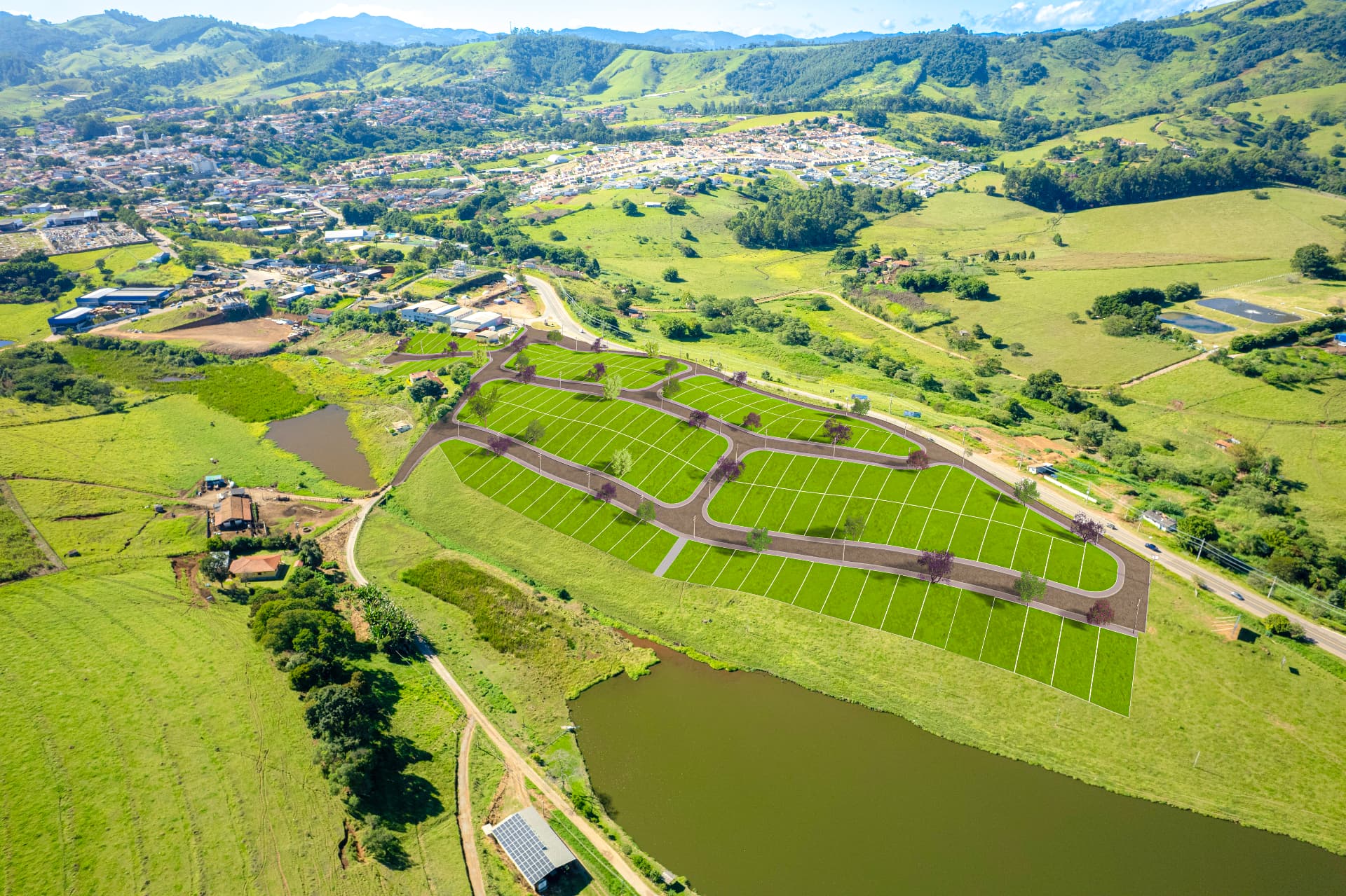 Implantação do Residencial Portal do Lago vista do alto, cercada pelas montanhas de Joanópolis